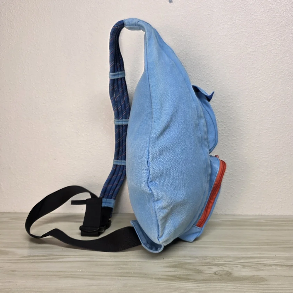KAVU Denim Blue Sling Backpack with Orange Accents, Adjustable Rope Strap